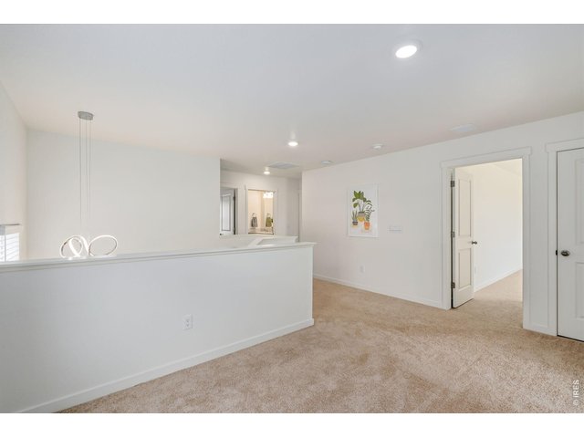 Property Photo 22 Upstairs, you'll find a spacious loft/flex area, a convenient laundry room, and four well-appointed bedrooms. 