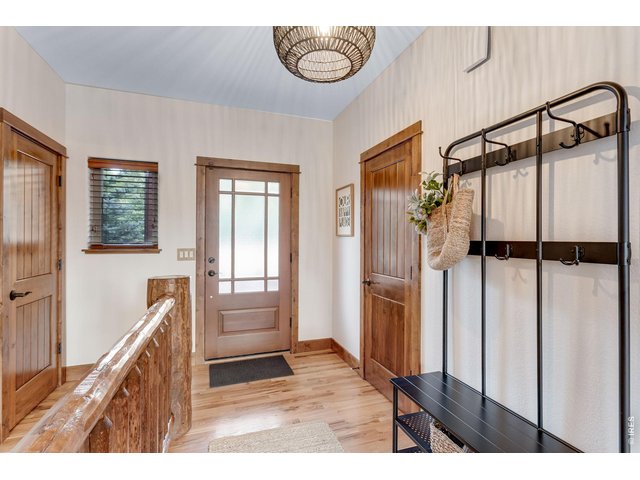 Property Photo 11 Main entrance with coat closet and garage access.