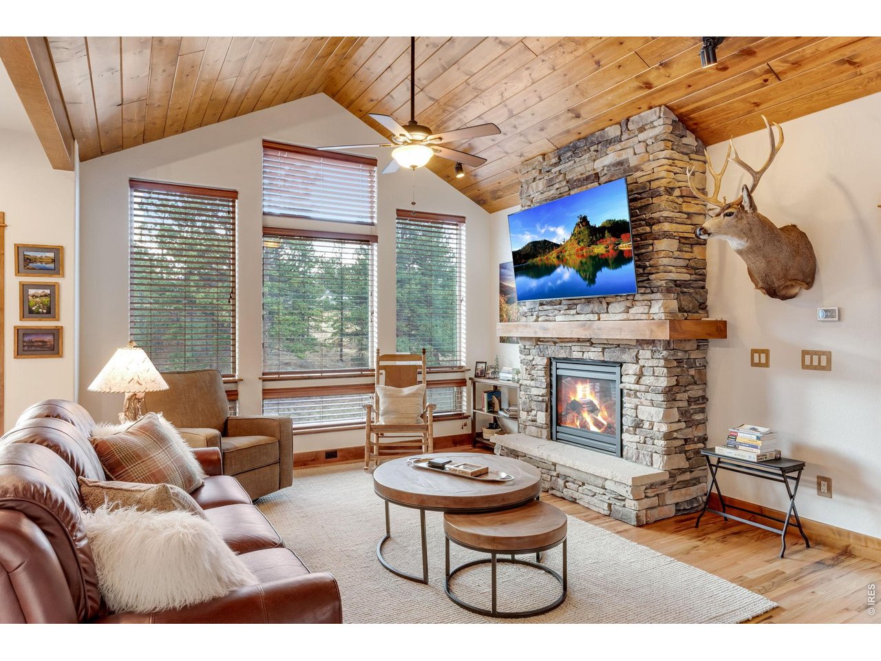 Soaring vaulted ceiling with gas fireplace.