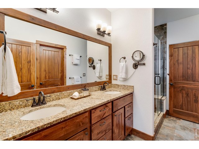 Property Photo 29 Primary bathroom with double sinks.