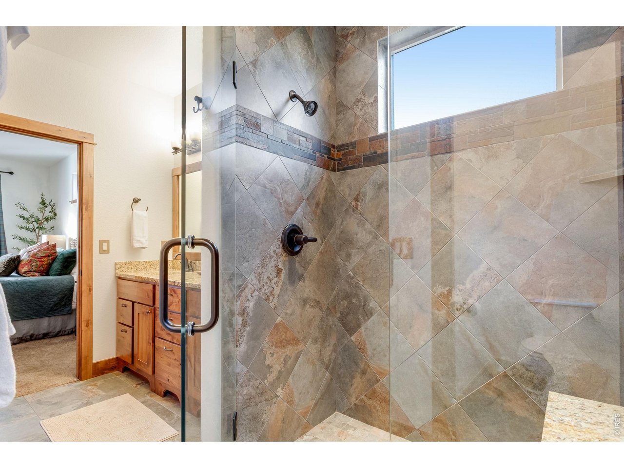 Beautiful tile shower in primary bath.