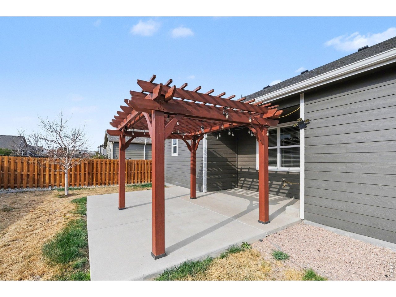 Property Photo 15 Spacious patio with beautifully crafted wood pergola