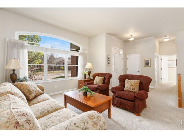 Property Photo 4 Formal living room with an abundance of windows