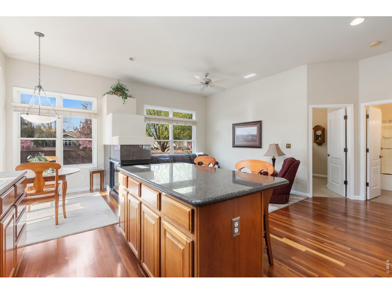 Granite kitchen island and hardwood floors