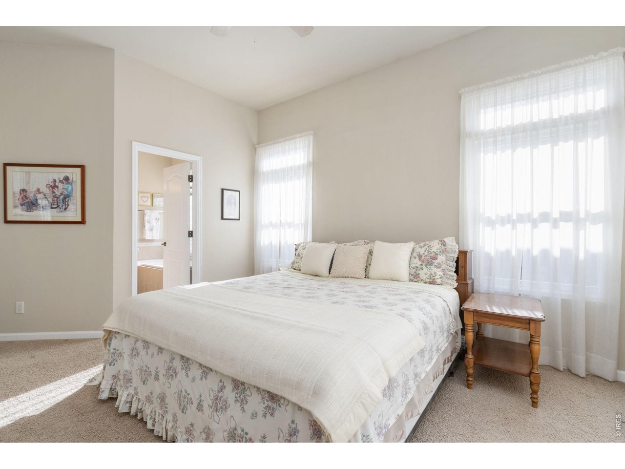 Primary suite flooded with natural light