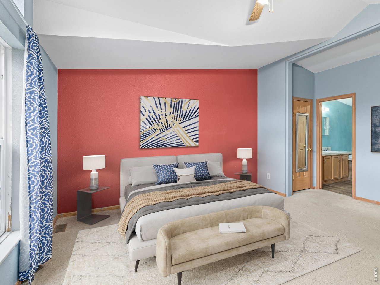 The generous primary suite includes vaulted ceilings and walk in closet