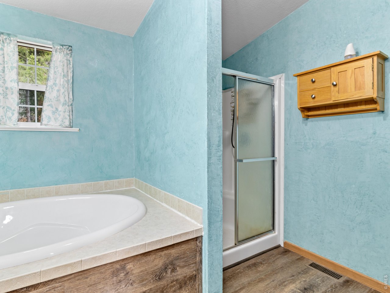 Primary suite includes a five-piece bath with large soaking tub and walk in shower 
