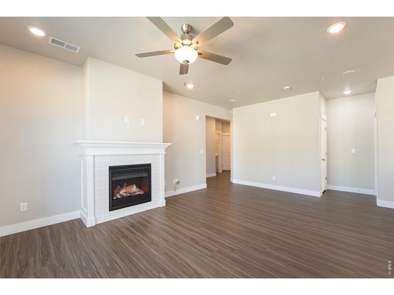 Property Photo 7 Control comfort with your included ceiling fan and gas fireplace. 