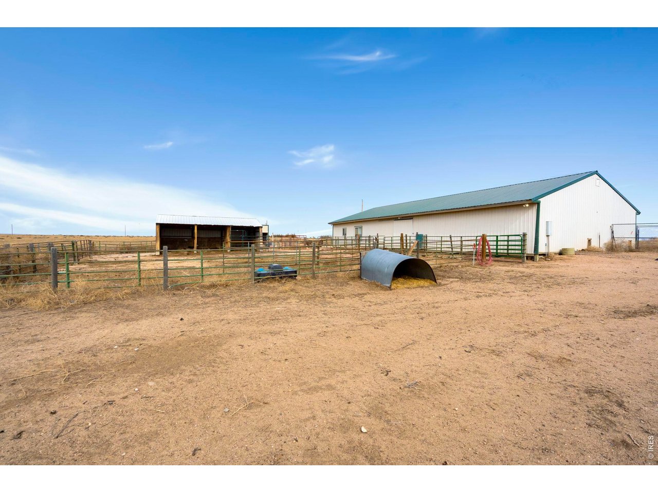 View of barn and paddock from back of home