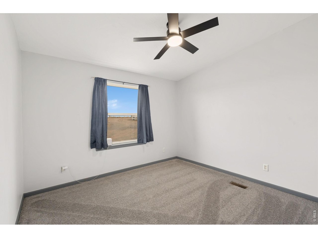 Bedroom 2 with new carpet and fan