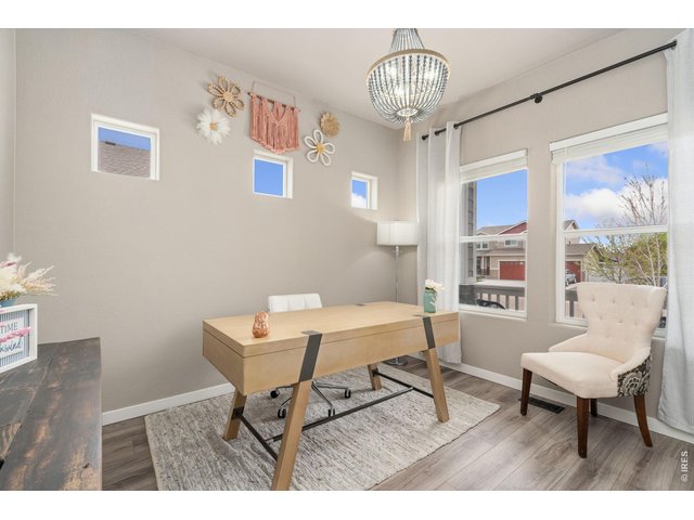 Property Photo 7 Main floor office with elegant French doors, Stylish upgraded light fixtures throughout the home