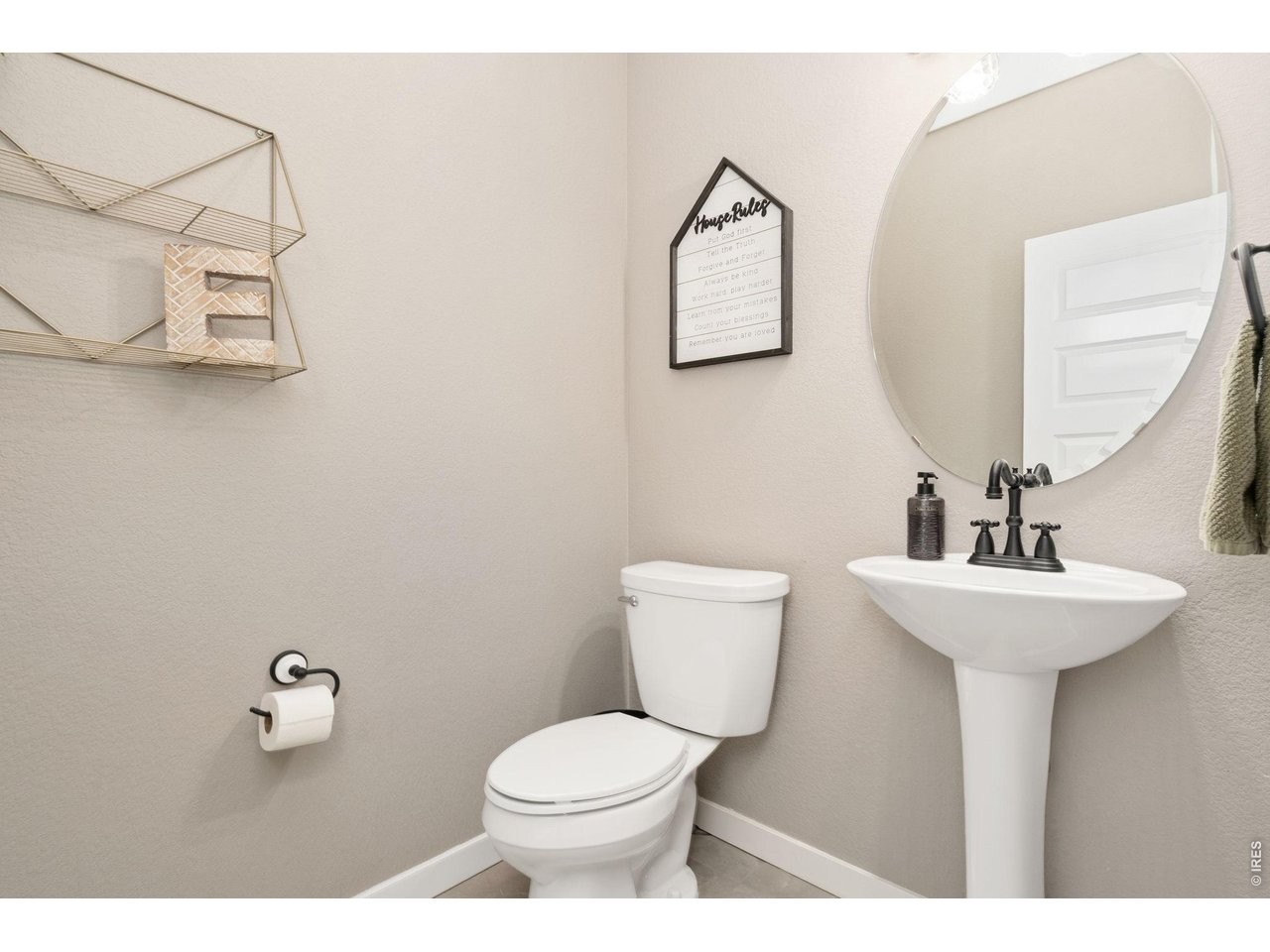 Main floor half bathroom with pedestal sink