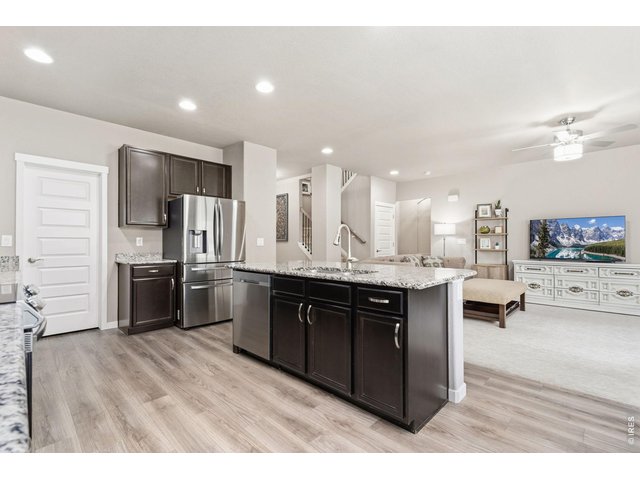 Property Photo 18 Durable and modern luxury vinyl plank flooring, granite countertops with timeless appeal, walk-in pantry with generous storage