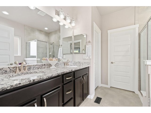 Property Photo 21 Dual sink vanity with plenty of space, walk-in closet with ample storage