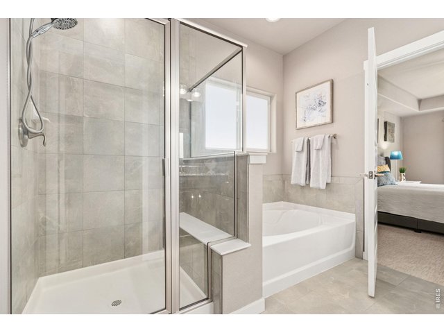 Property Photo 22 Luxurious 5-piece primary bathroom, large soaking tub perfect for unwinding