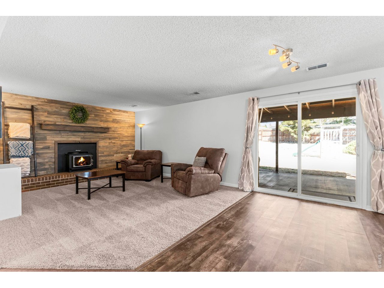 Lower level living room with sliding glass door