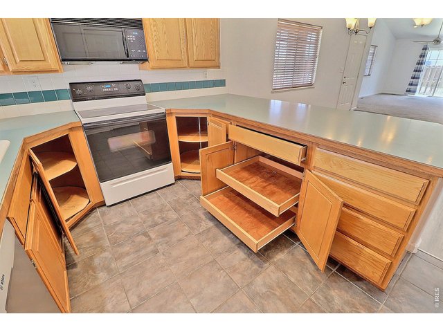 Property Photo 17 Lots of Cabinets and Roll-Out Drawers with 2 Corner Turn-Tables