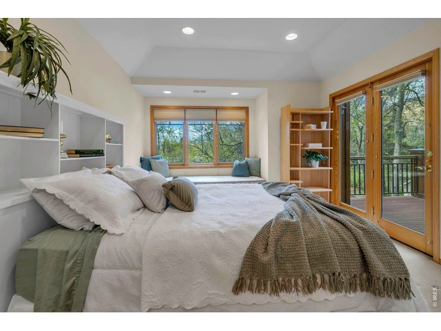 Property Photo 32 Upper ensuite bedroom with window seat and deck