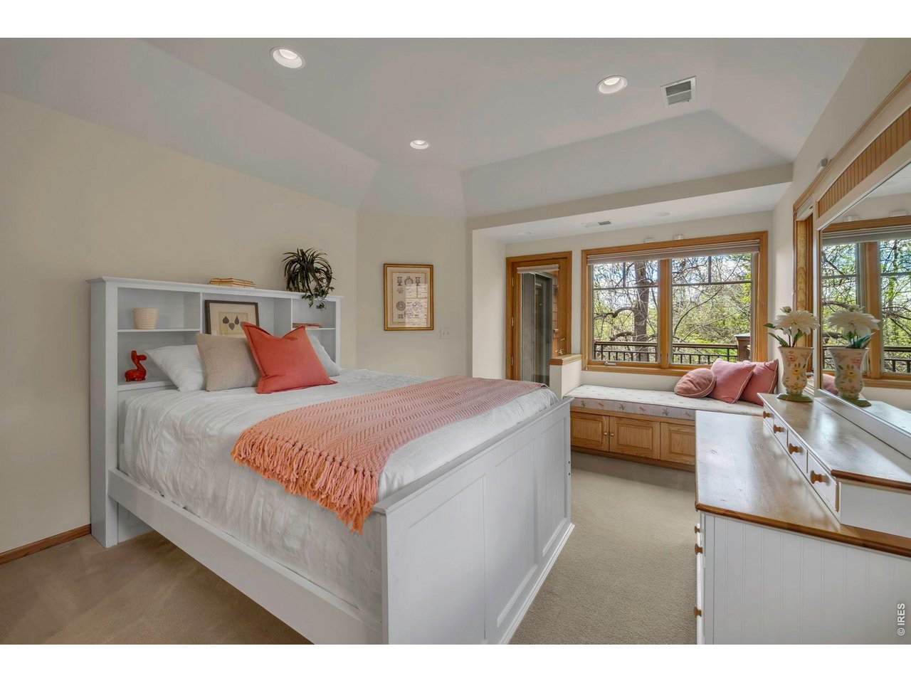 Third upper level bedroom with window seat and deck