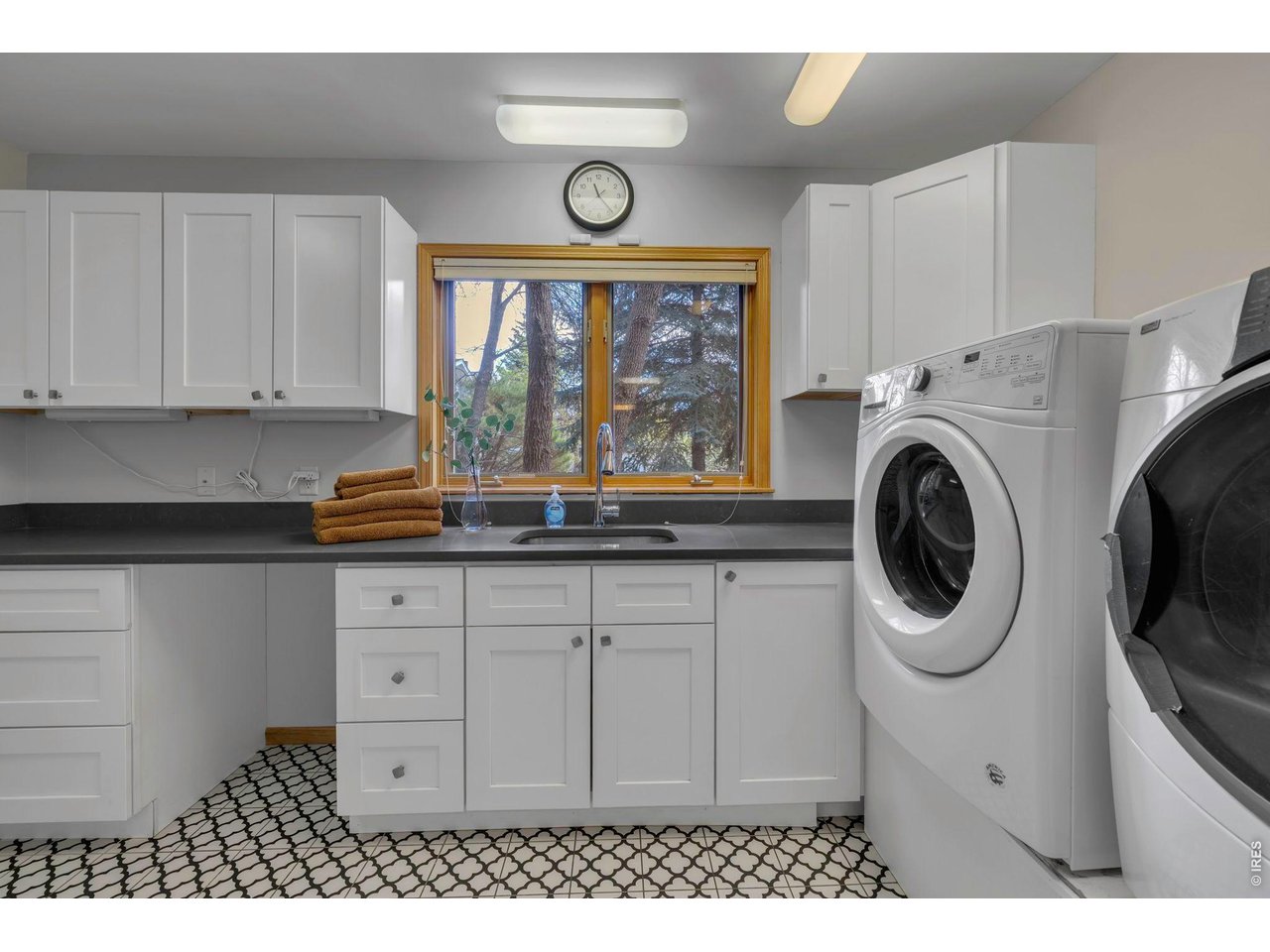 Large laundry and home workshop with over sized supply closet