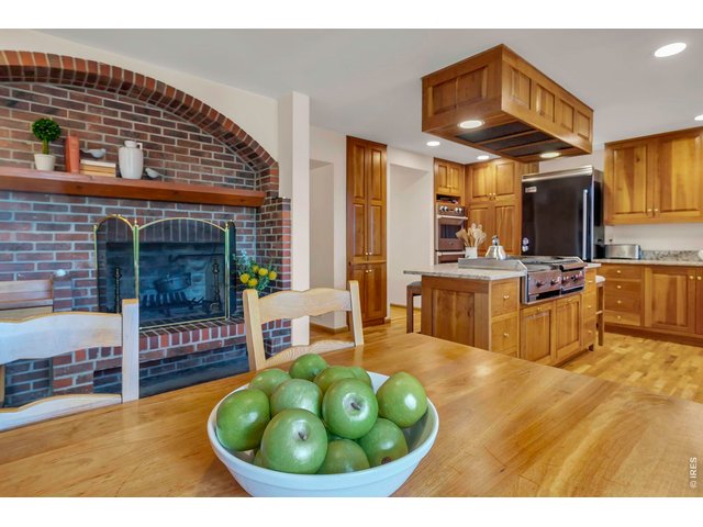 Property Photo 10 Breakfast nook with fireplace with swing arm