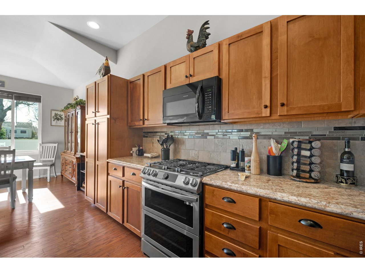 Top of the Line Gas Range and Convection Oven does all kinds of cooking modes from Bread Proofing, Air Frying, to Dehydrating-- A Chef's Dream Kitchen! All Black Appliances are included