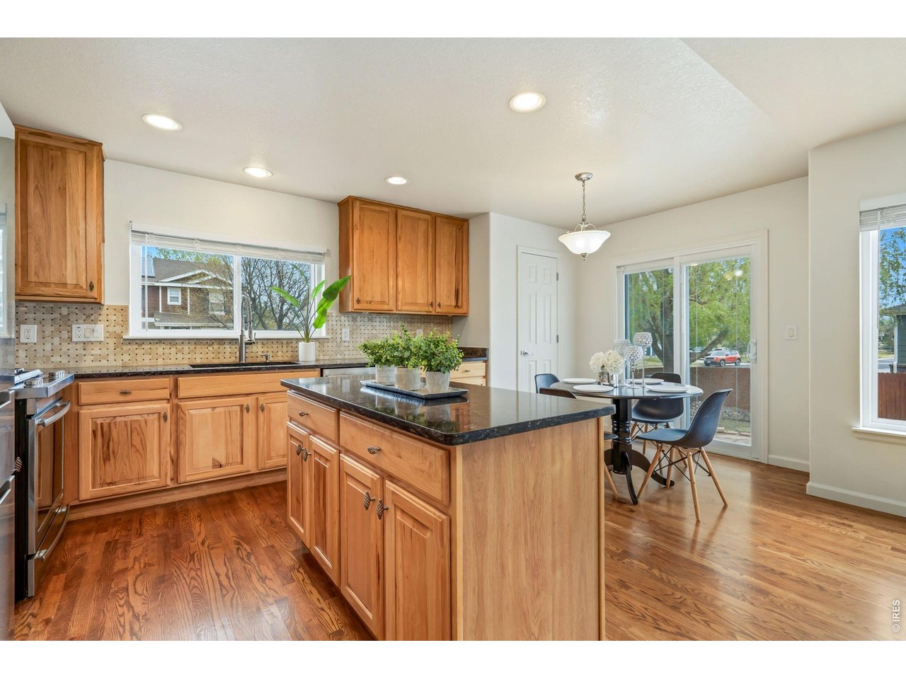 Hardwood floors with an eat in dining area