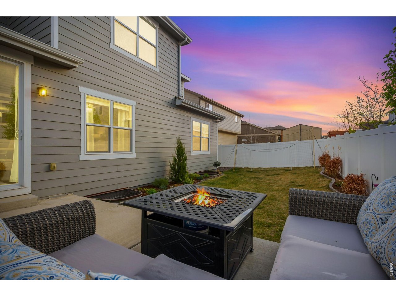 Thoughtfully landscaped backyard with privacy fencing