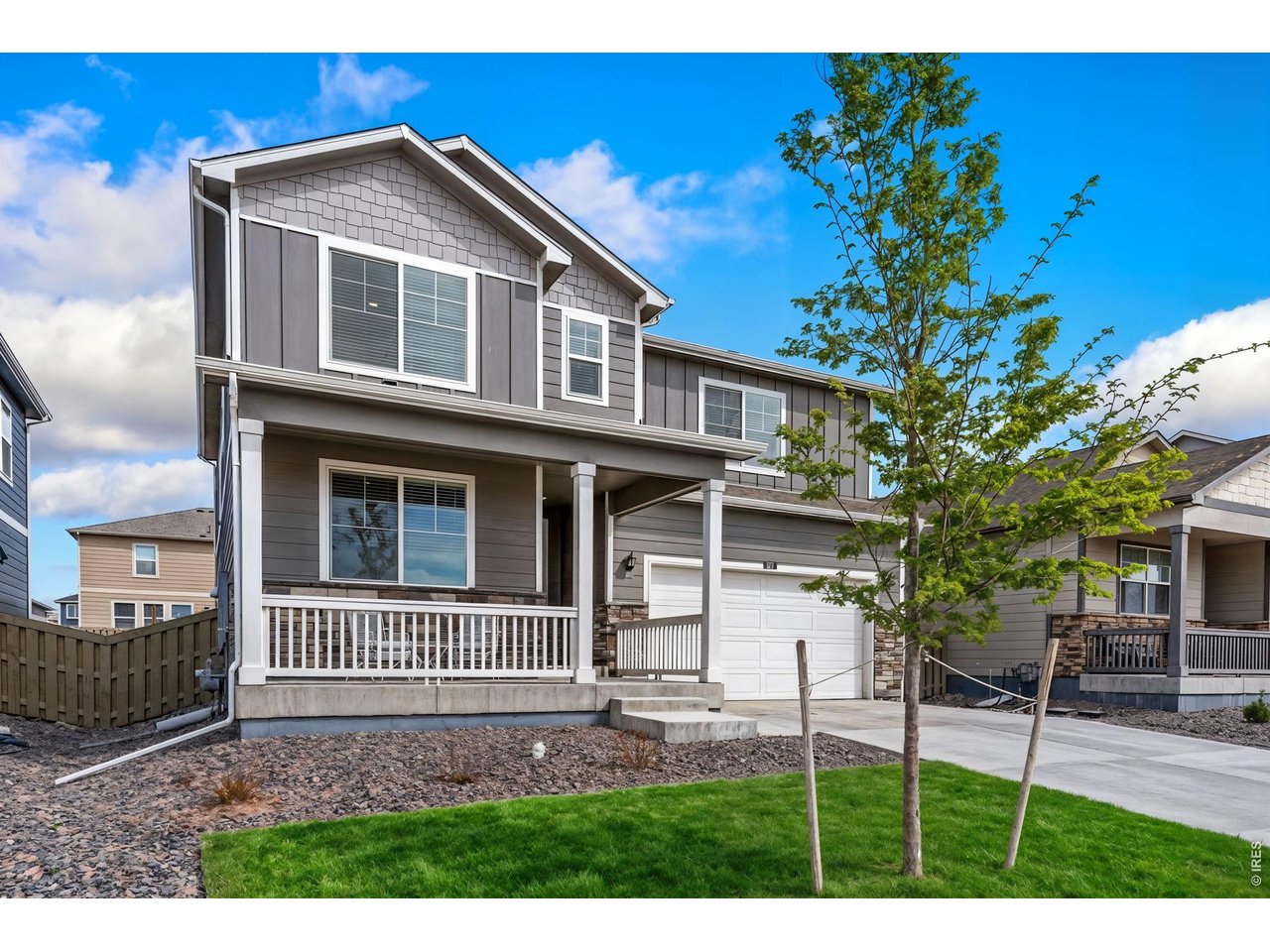 This S. facing home has fencing already installed, landscaping/irrigation in place & high end kitchen appliances. Garage has electric vehicle wiring. Lawn photos have been enhanced to showcase spring/summer potential. 