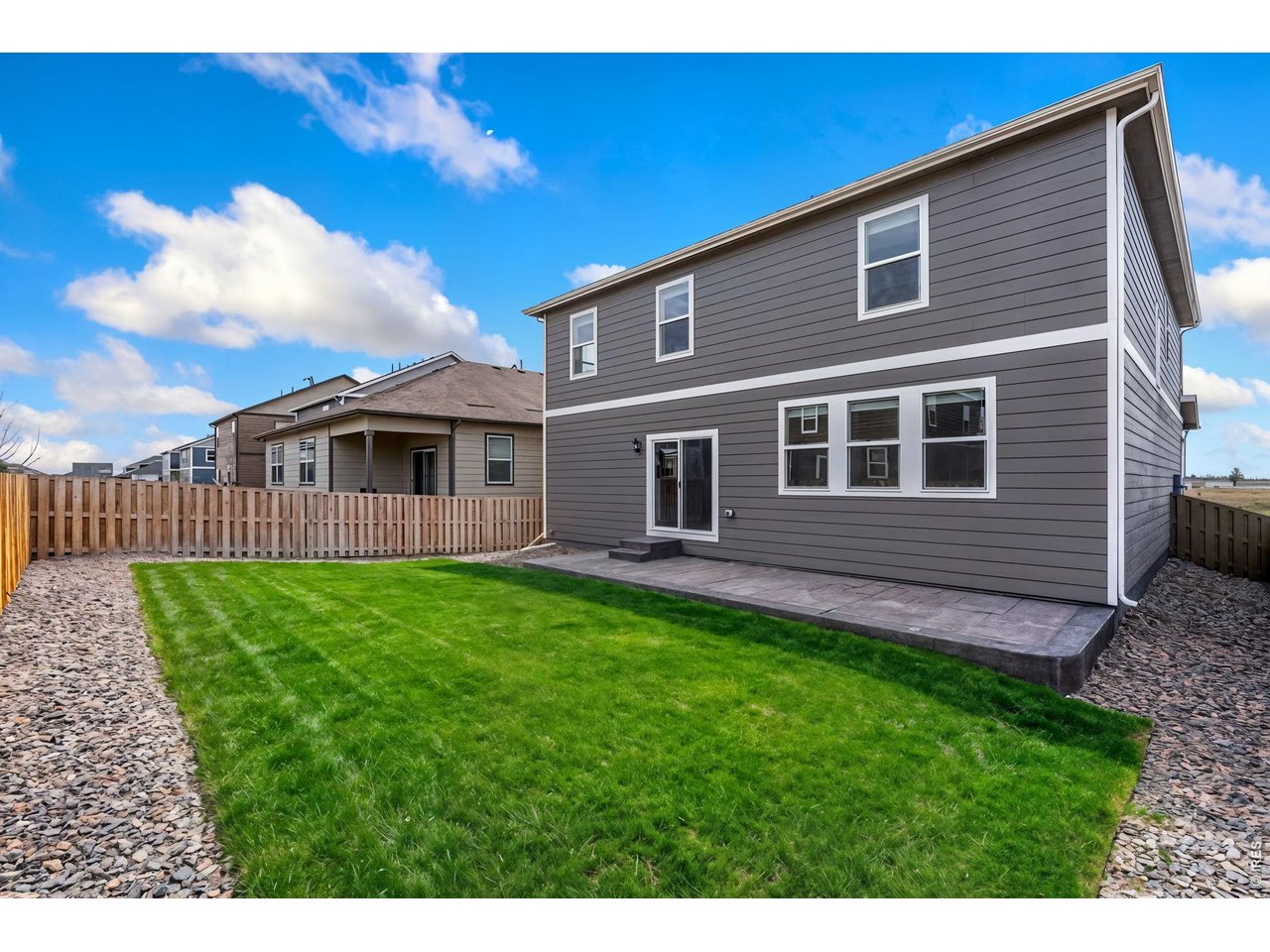 Step outside to enjoy the fully landscaped and fenced backyard featuring a huge stamped concreate patio, ideal for relaxing or entertaining. Lawn photos have been enhanced to showcase spring/summer potential. 