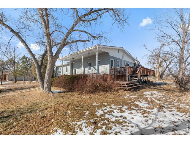Property Photo 3 Double porches - enjoy sitting up front or the East side with some shade for your summer barbecues!