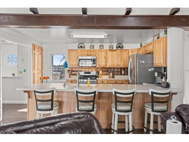 Property Photo 7 Remodeled kitchen with large peninsula with barstool seating.