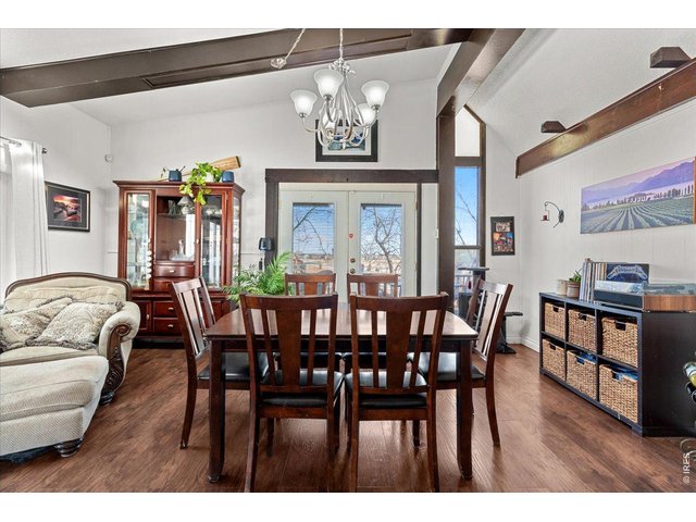 Property Photo 9 Dining room with french doors leading onto the East porch space.