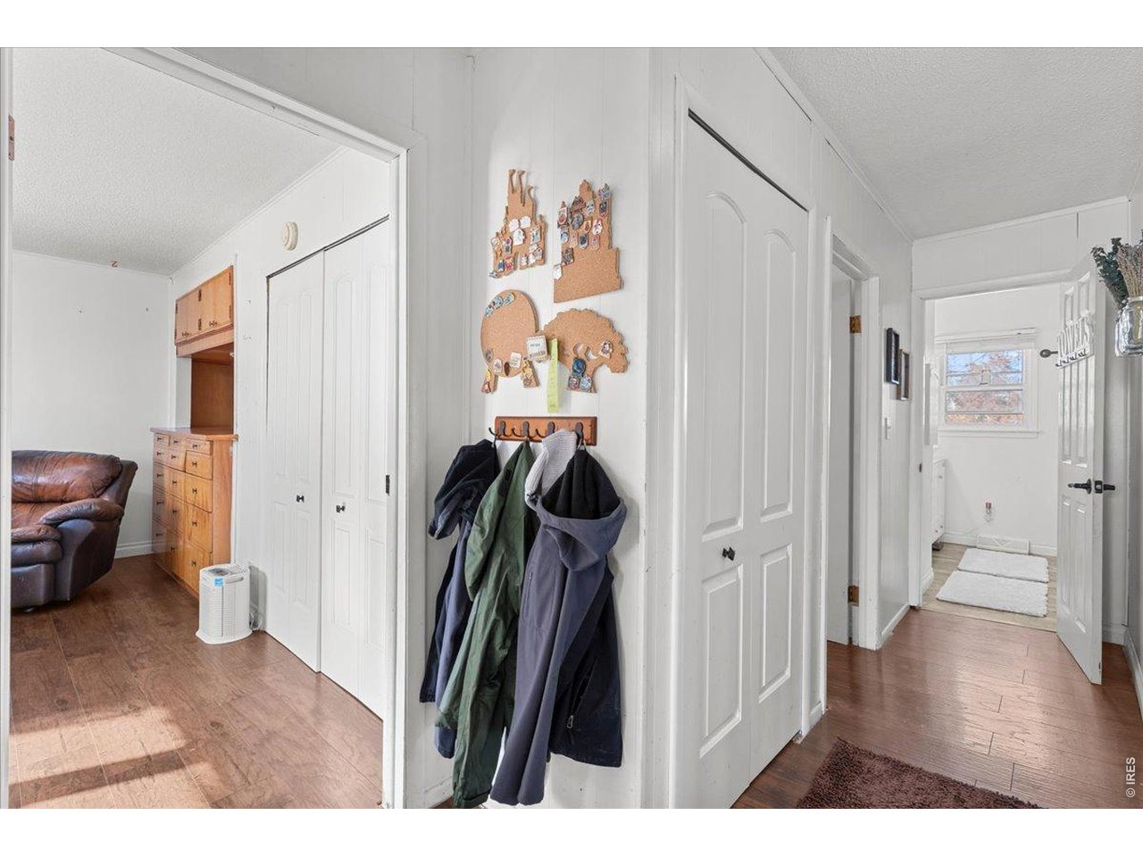 Hallway with 2nd Bedroom left and main bathroom right. Linen closet in hallway.