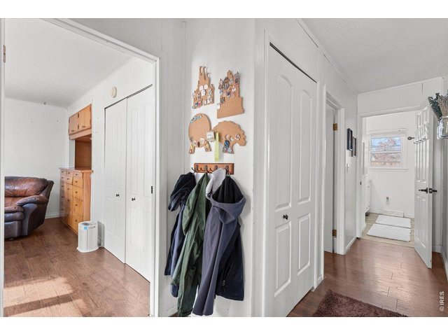 Property Photo 22 Hallway with 2nd Bedroom left and main bathroom right. Linen closet in hallway.