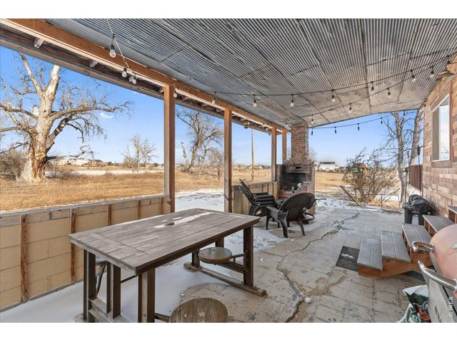 Property Photo 30 Covered porch with repurposed metal ceiling.