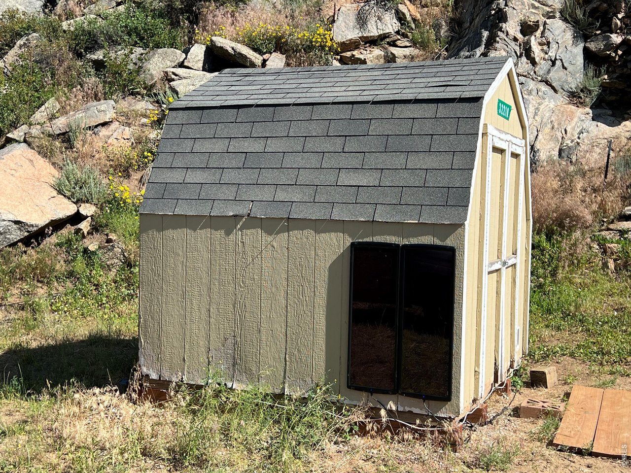 50W solar panels on shed with charge controller (inverter compatible, inverter not included).