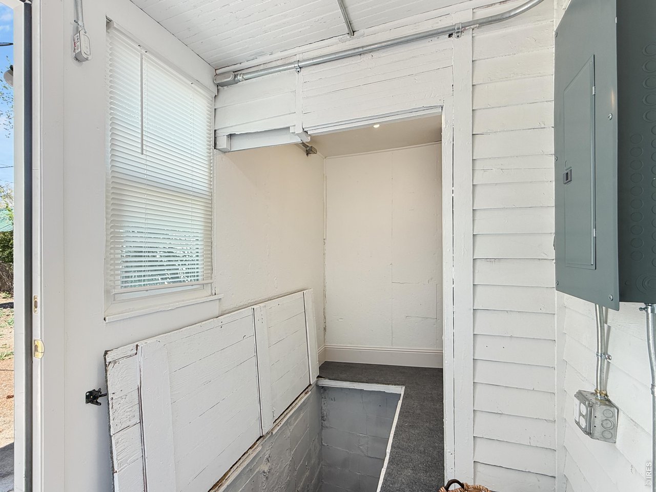 Trap door leads to basement area