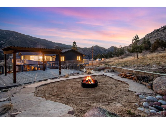 Property Photo 4 Enjoy evenings by the fire pit overlooking the Rocky Mountains! Does it get any better?