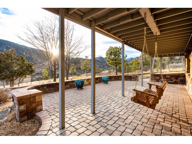 Property Photo 8 Unrivaled 360 degree views! Enjoy evenings on the porch watching the sunset with incredible views of the surrounding landscape. Home features ample outdoor sitting areas including a covered patio, large wrap around deck and fire pit!