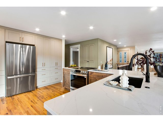 Property Photo 23 Stainless-steel appliances all included in the sale! Farmhouse style sink, quartz countertops and updated fixtures!