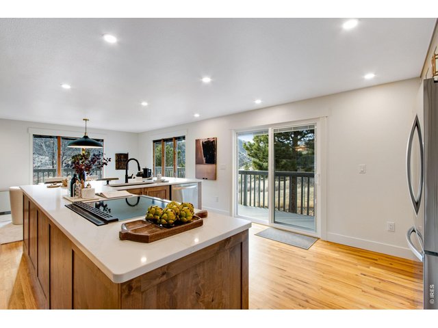 Property Photo 24 Kitchen has direct access to the wrap around deck perfect for entertaining inside or out.