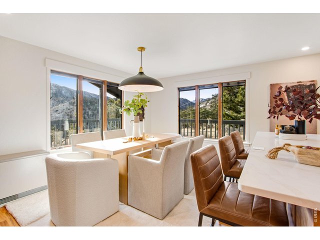 Property Photo 26 Large dining area with panoramic views and updated lighting features.