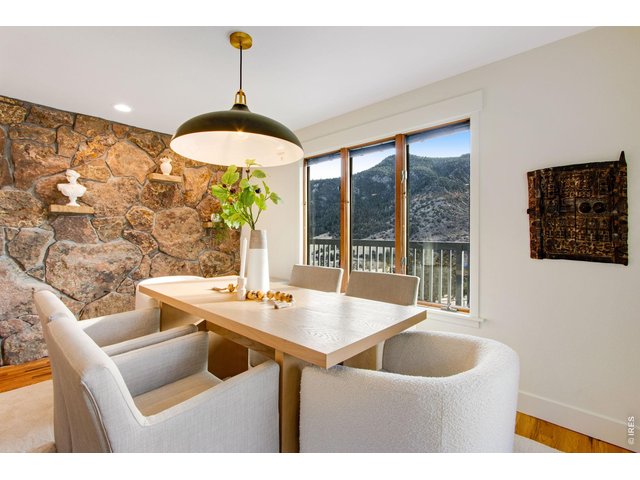 Property Photo 27 Large dining area with panoramic views and updated lighting features.