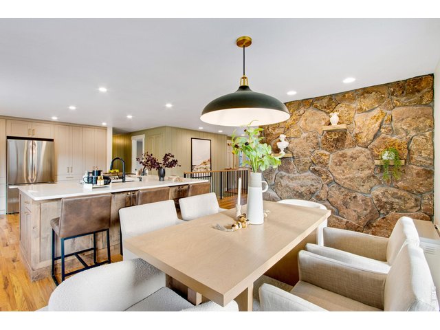 Property Photo 28 Large dining area with panoramic views and updated lighting features.