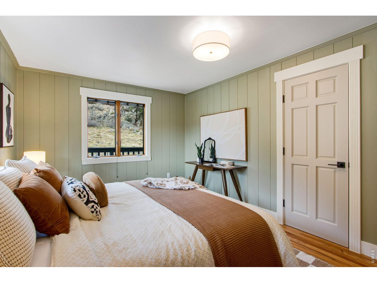 Primary suite w/ private bath, quartz countertops, floor-to-ceiling tile shower, & full-length walk-in closet.