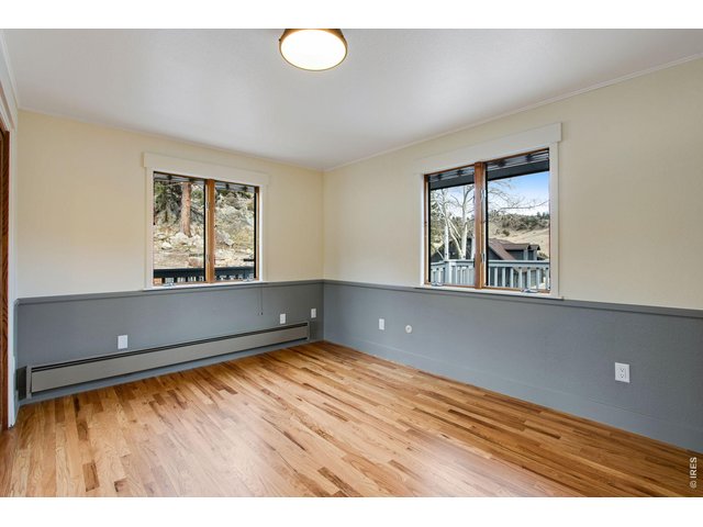 Property Photo 33 Guest bedroom with hardwood floors!