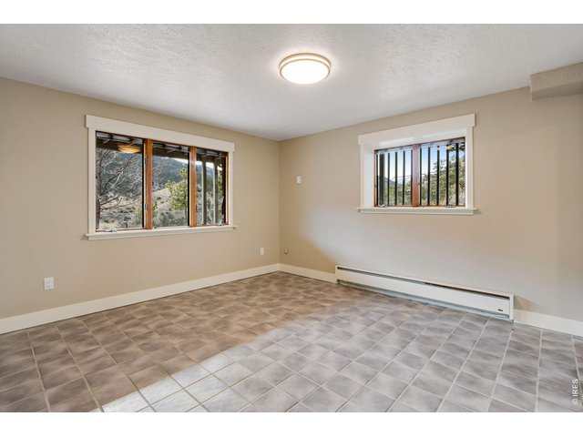 Property Photo 39 Lower level bedroom 4 is perfect for an in-home office or workout area.