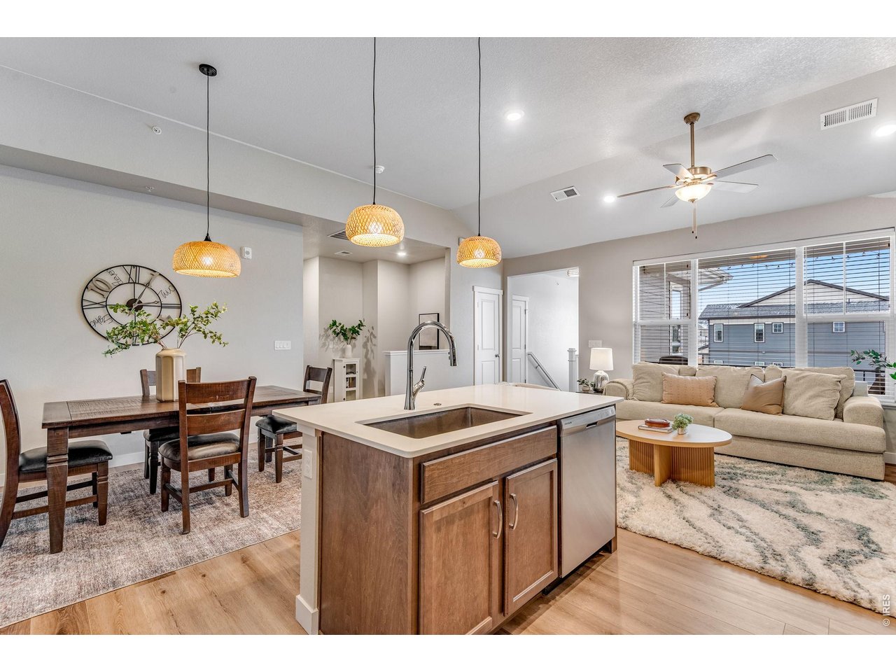 Another angle of the kitchen, dining and living.