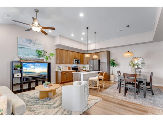 Property Photo 18 Featuring a high efficiency furnace, tankless water heater & gorgeous designer finishes: quartz counters, full kitchen subway tile splash, maple cabinetry, stainless steel appliances and stainless appliances.